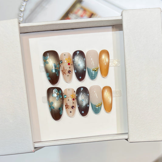 hand-painted reusable almond press-on nails with gold and turquoise floral design