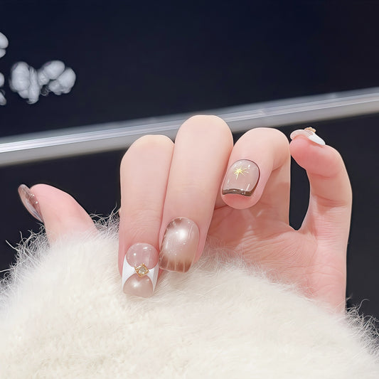 Close-up of a hand Short square handmade press-on nails with cat-eye shimmer and crocodile texture