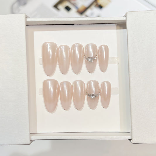Minimalist handmade press-on nails in pearl finish with crystal details