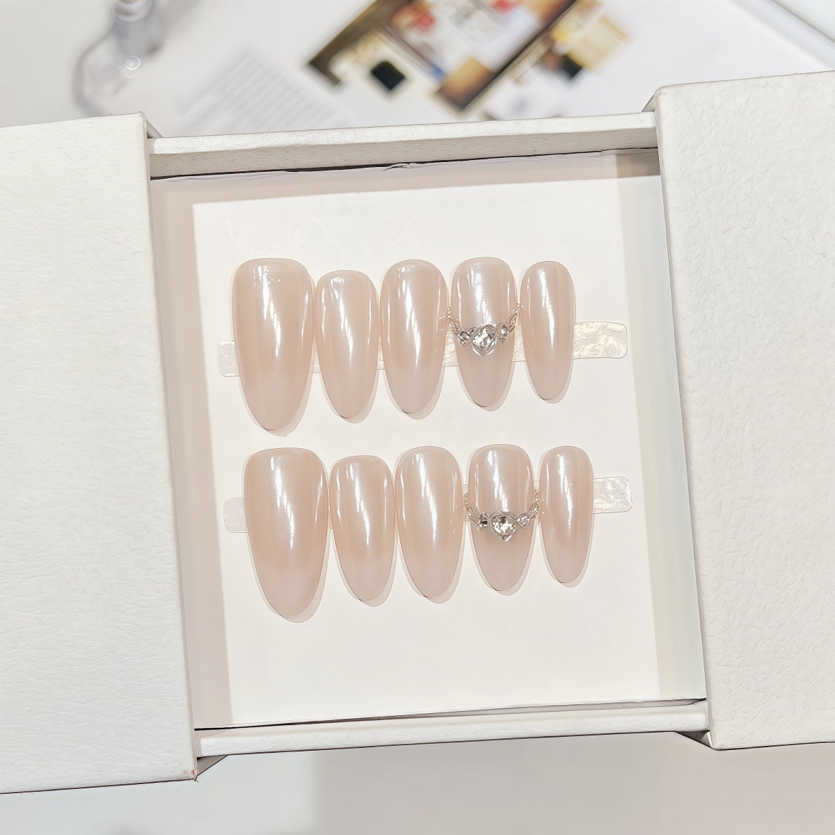 Minimalist handmade press-on nails in pearl finish with crystal details