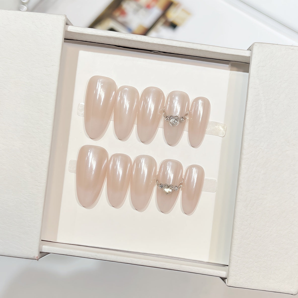 Minimalist handmade press-on nails in pearl finish with crystal details