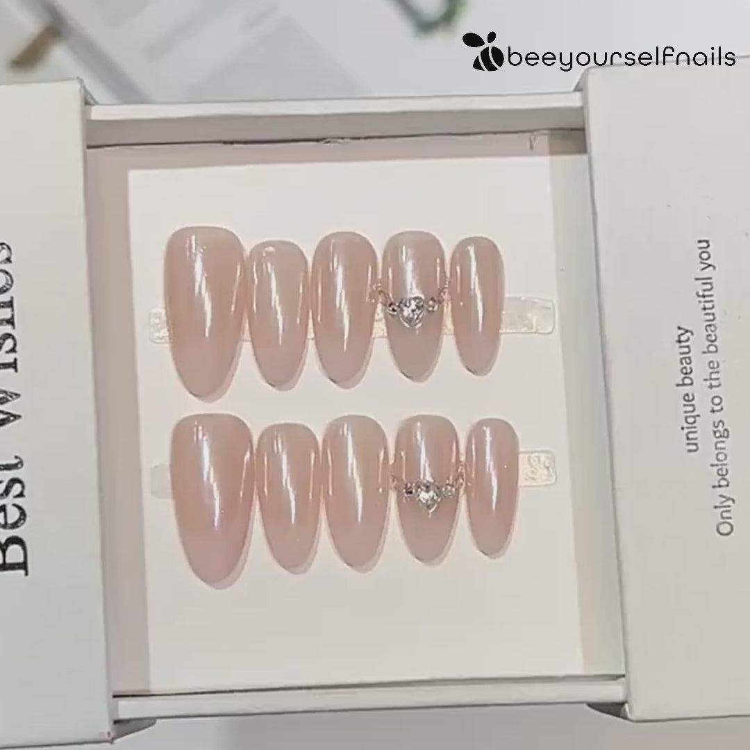 Minimalist handmade press-on nails in pearl finish with crystal details